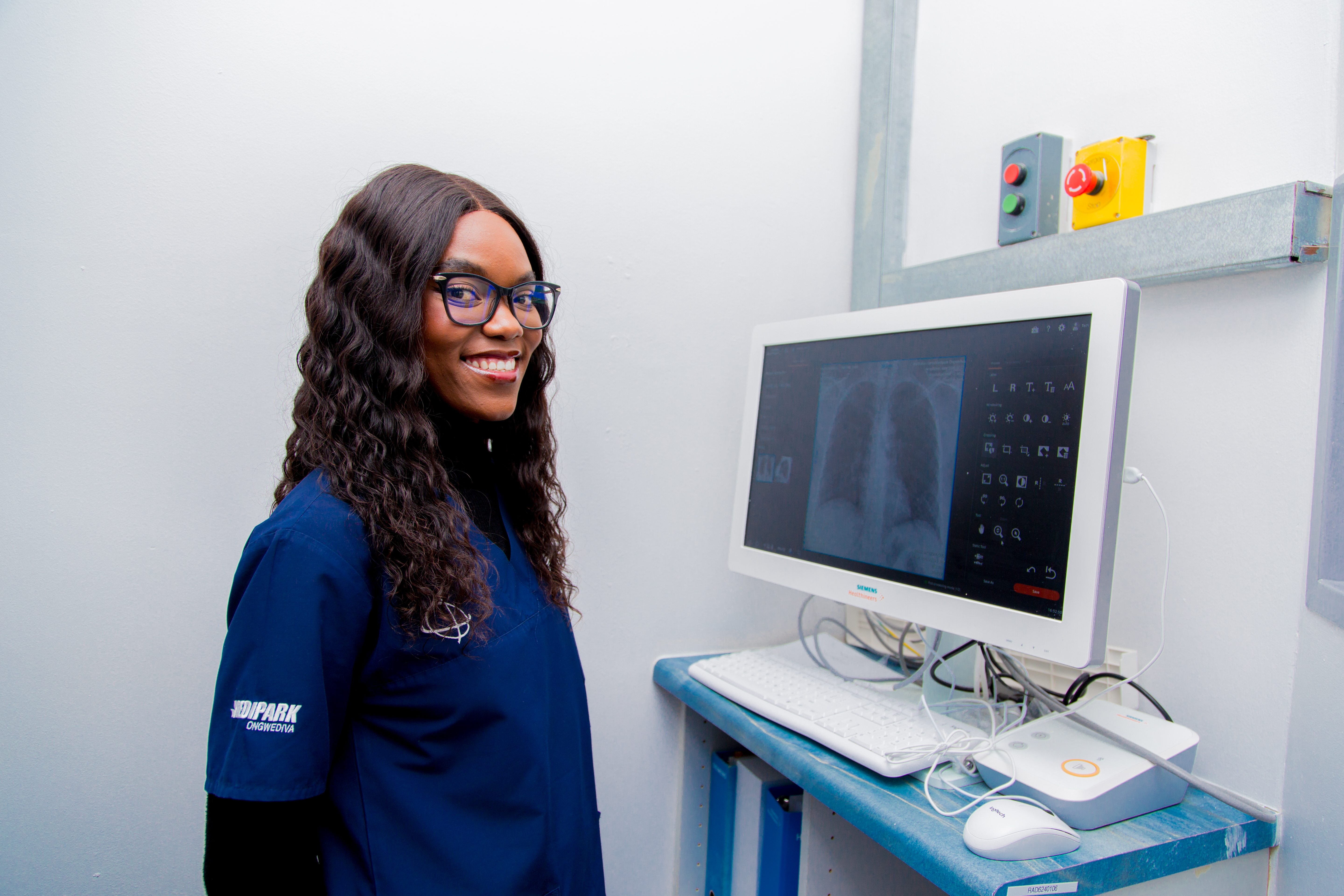 Radiographer reviewing medical images